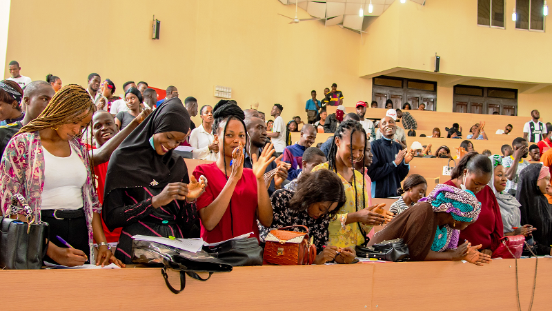 Youth in auditorium celebrating